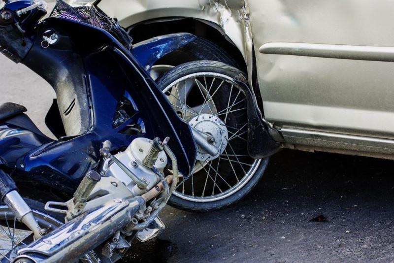 motorcycle crashing into a sedan