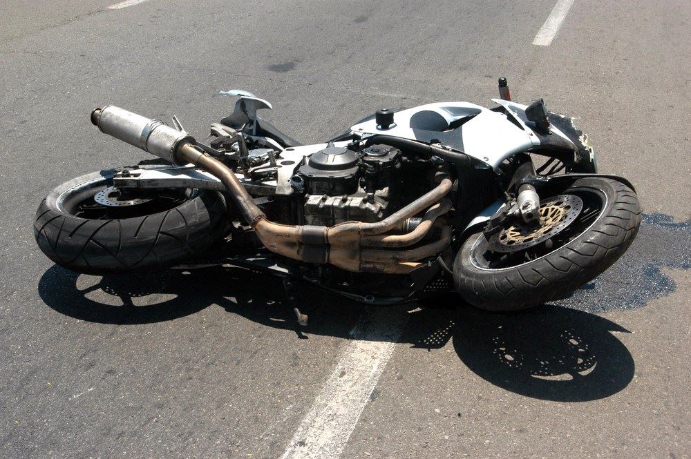 motorcycle on ground after accident