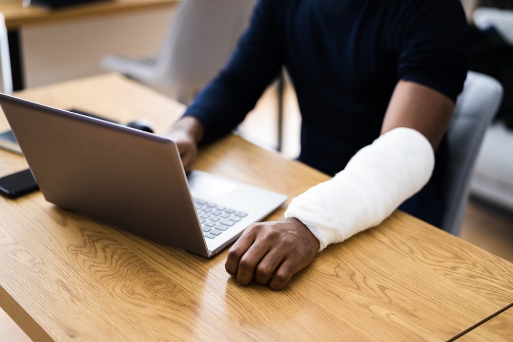 injured worker filling out a claim online