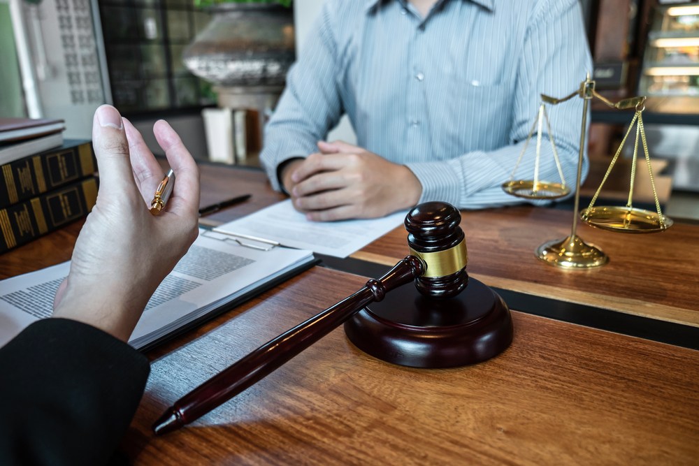 A lawyer talks with a client