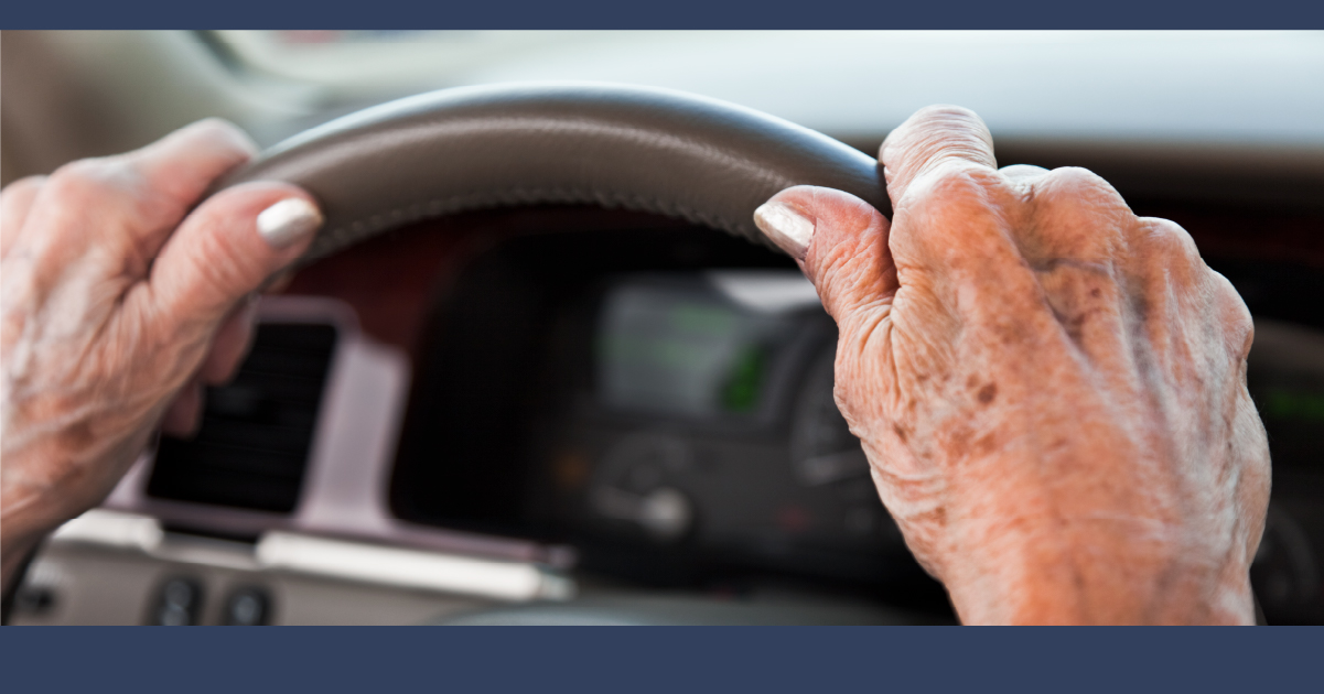 An Elderly Driver at the Steering Wheel