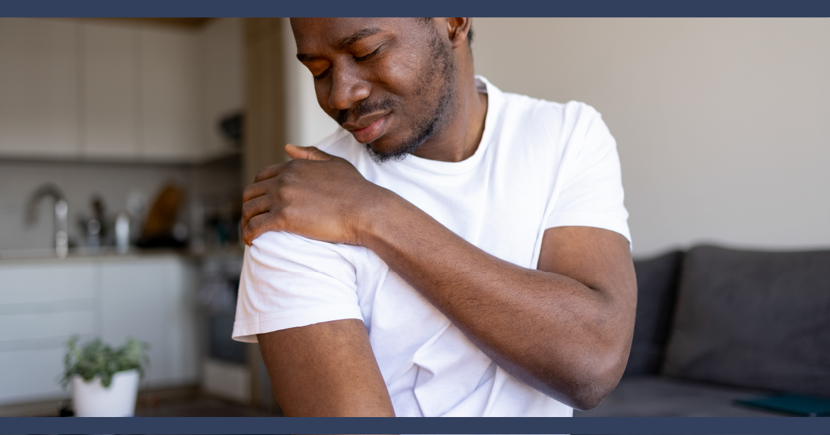 Man nursing his shoulder from pain or injury