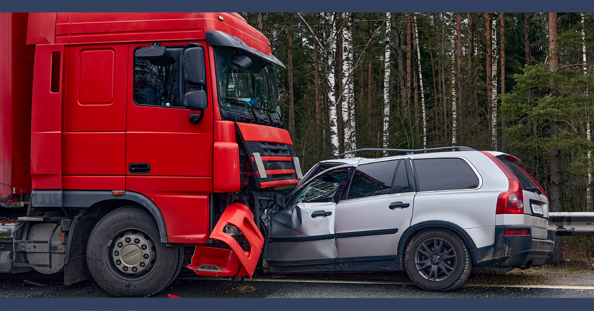 Red truck and a silver car after a head-on collision