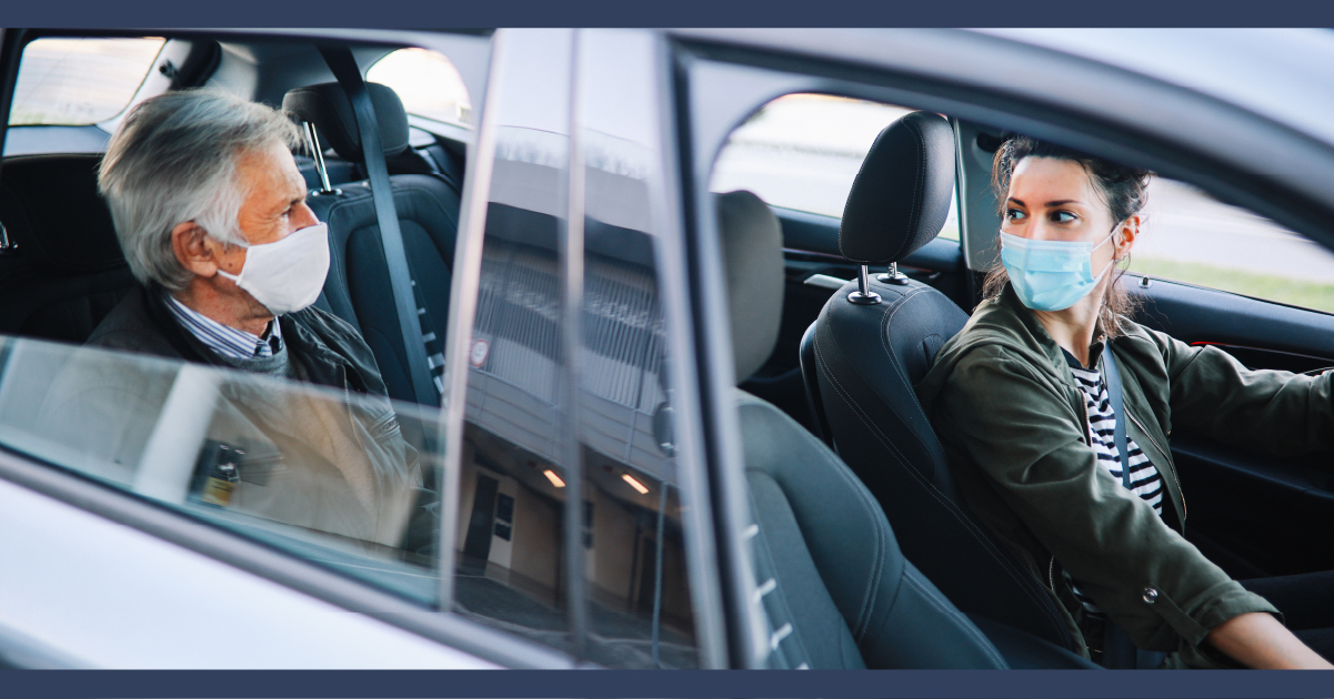 Ride share passenger and driver interacting while seating in the car.