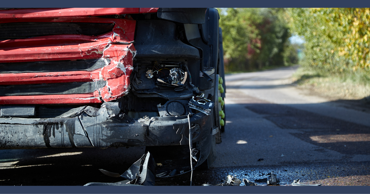 Impact damage to the front of a red truck