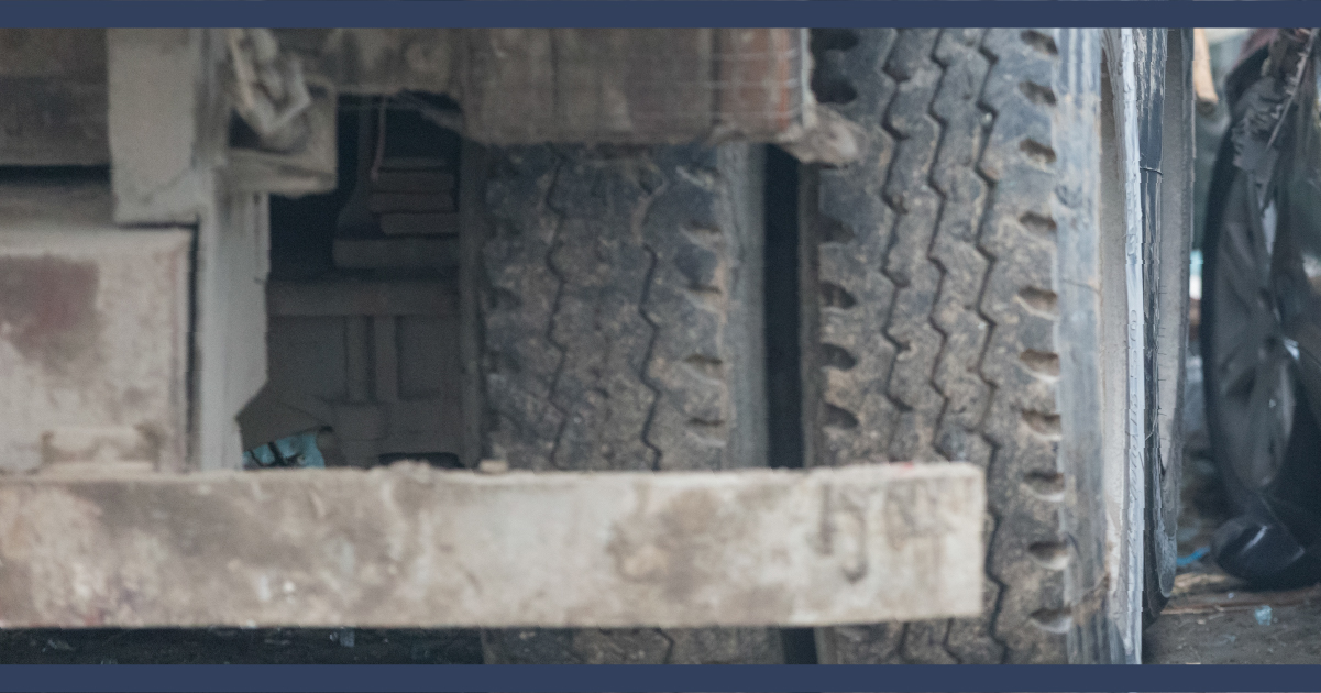 Close-up view of bus wheels and bumper