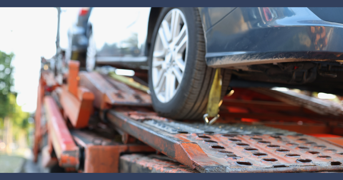 Car on the back of a tow truck after an accident