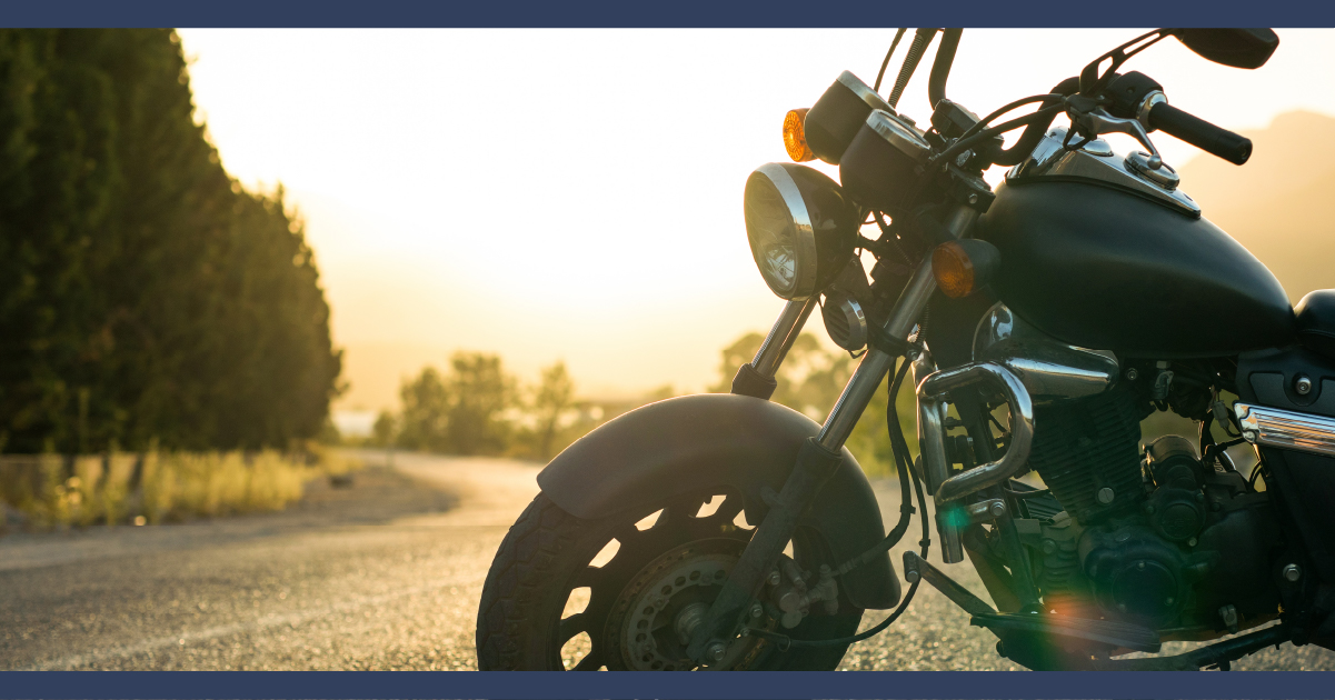 Classic Motorcycle Backlit by the Setting Sun