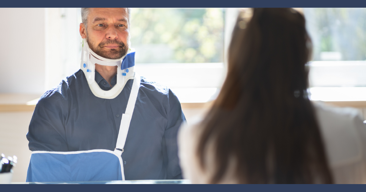 Man with cast on at a meeting with lawyer
