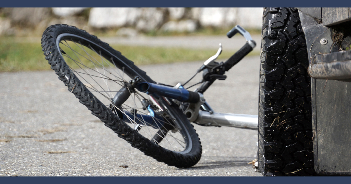 Bicycle crushed under car wheel