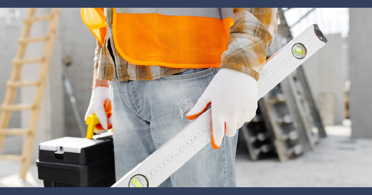 Construction worker holding tools