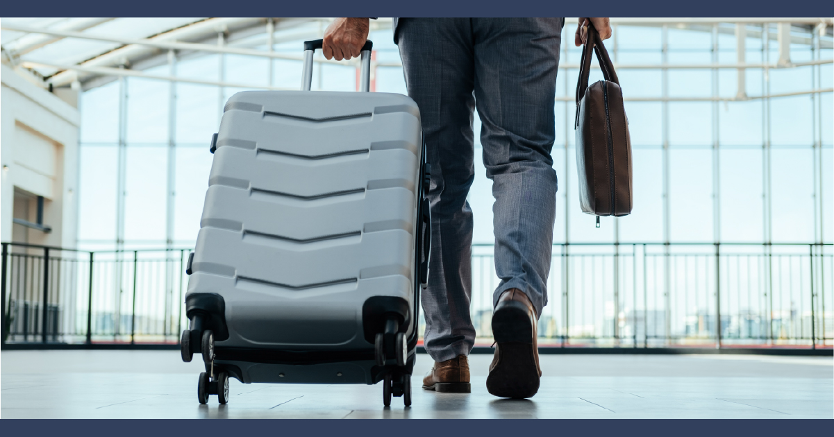 Iowa Aviation Accidents Feature Image: Traveler pulling suitcase in a concorse